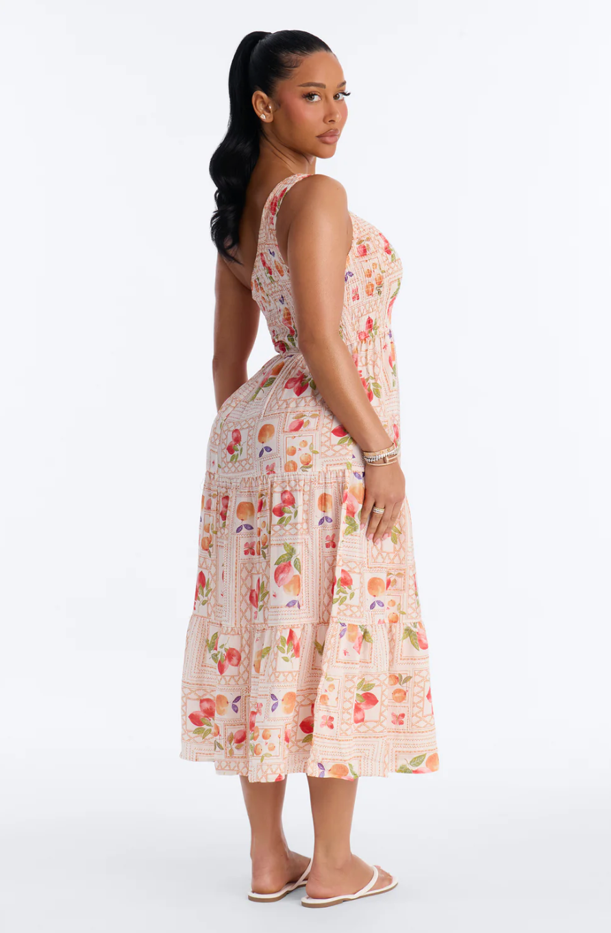 Woman wearing a floral dress on a white background