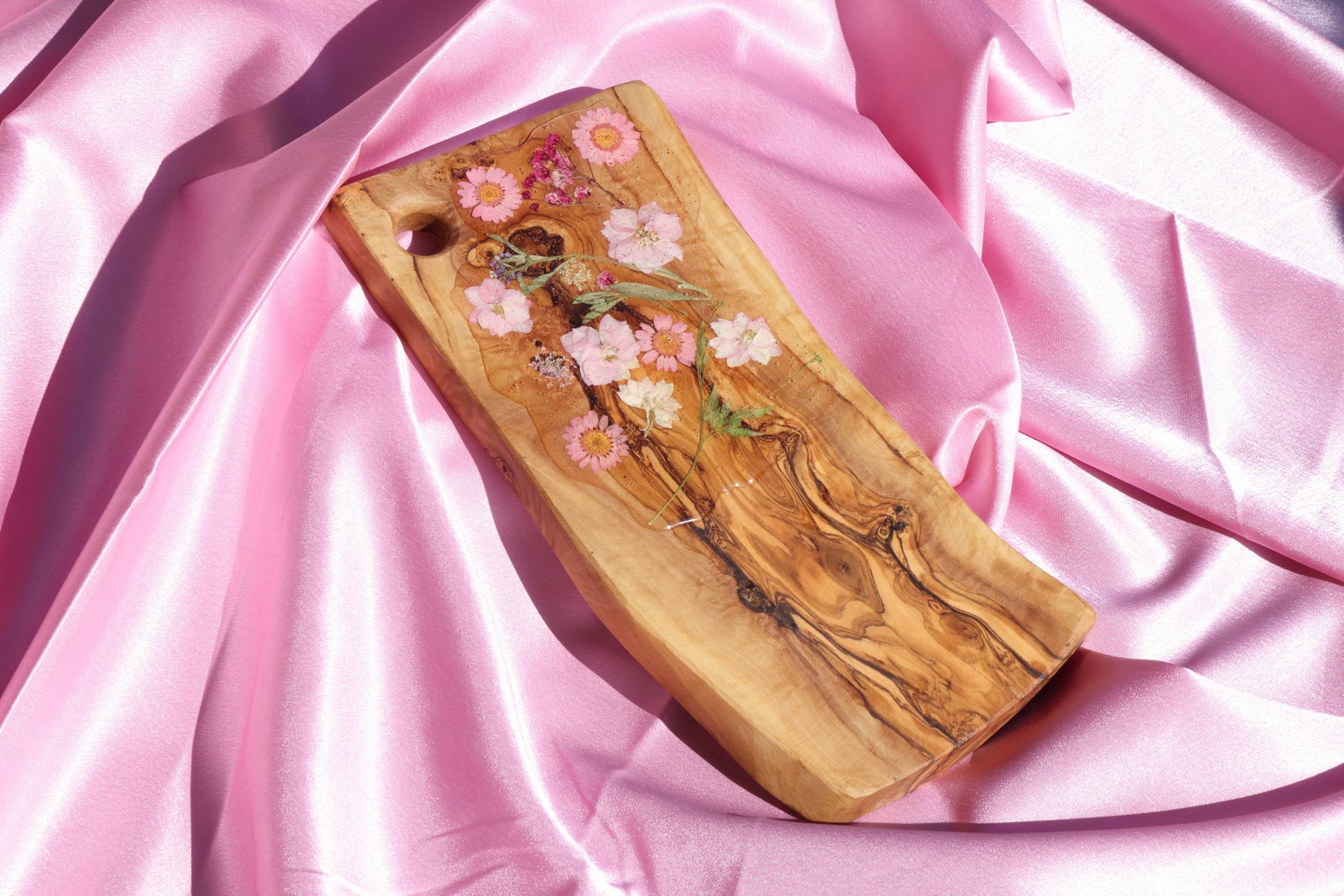 Wood Board with Pink Flowers covered in resin.