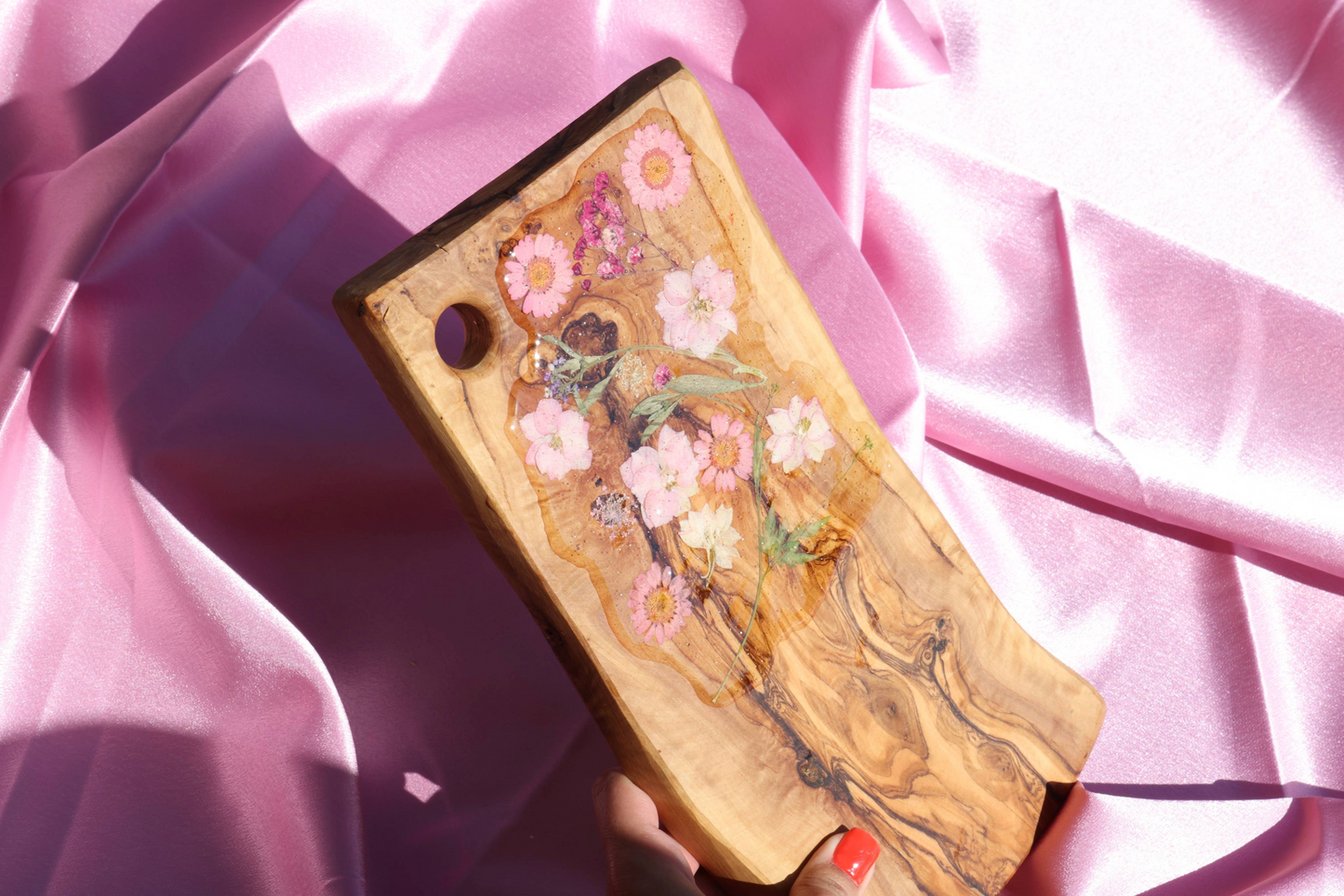 Hand Holding a charcuterie board